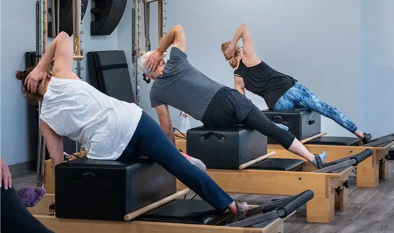 Beginner reformer Pilates classes designed to build foundational strength, alignment, and controlled movement
